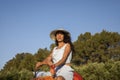 Sexy tourist between the enjoying the desert of the palm grove of Marrakech in Morocco on a camel or dromedary Royalty Free Stock Photo