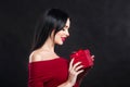 Valentine model Girl portrait. Gorgeous young brunette woman with red gift box. Perfect make up. Valentine` Day brunette lady Royalty Free Stock Photo