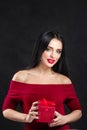 Valentine model Girl portrait. Gorgeous young brunette woman with red gift box. Perfect make up. Valentine` Day brunette lady Royalty Free Stock Photo