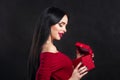 Valentine model Girl portrait. Gorgeous young brunette woman with red gift box. Perfect make up. Valentine` Day brunette lady Royalty Free Stock Photo
