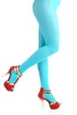 Sexy view of slim woman body lower part wearing light blue tights and high-heeled shoes Royalty Free Stock Photo