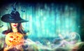 witch with a Halloween pumpkin Jack-o-lantern Royalty Free Stock Photo