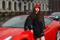 woman against red sport car Royalty Free Stock Photo