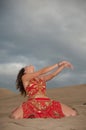 woman belly dancer arabian in desert dunes Royalty Free Stock Photo
