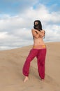 woman belly dancer arabian in desert dunes Royalty Free Stock Photo