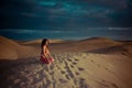 woman belly dancer arabian in desert dunes Royalty Free Stock Photo