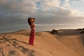 woman belly dancer arabian in desert dunes Royalty Free Stock Photo