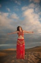 woman belly dancer arabian in desert dunes Royalty Free Stock Photo