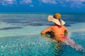 woman in bikini on the beach, summer travel holiday background in Maldives Royalty Free Stock Photo