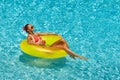 woman in bikini enjoying summer sun and tanning during holidays in pool Royalty Free Stock Photo