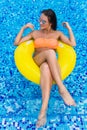 woman in bikini enjoying summer sun and tanning during holidays in pool. Top view. Woman in swimming pool. woman in biki Royalty Free Stock Photo