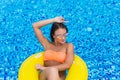 woman in bikini enjoying summer sun and tanning during holidays in pool. Top view. Woman in swimming pool. woman in biki Royalty Free Stock Photo