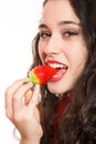 woman biting a strawberry Royalty Free Stock Photo