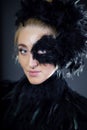 woman with black feather half mask Royalty Free Stock Photo