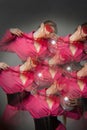 woman with bright pink clothes, nets on head Conceptual color photography in kaleidoscope.. Fashion style