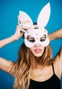 Sexy woman in bunny mask. Beautiful Easter girl in rabbit ears. Spring holidays.