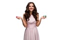 woman in a chic gently pink dress holding colored poker chips. Woman winning Royalty Free Stock Photo