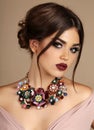 woman with dark hair and bright makeup, with necklace Royalty Free Stock Photo