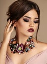 woman with dark hair and bright makeup, with necklace Royalty Free Stock Photo