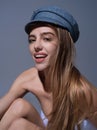 Sexy woman face. Sensual young woman posing with fashion cap hat. Beautiful sexy model. Beauty female face. Sensual girl Royalty Free Stock Photo