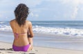 Woman Girl Sitting in Bikini on Beach Royalty Free Stock Photo