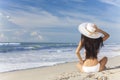 Woman Girl Sitting Sun Hat & Bikini on Beach Royalty Free Stock Photo