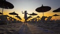 woman having fun walking on the beach at sunset Royalty Free Stock Photo