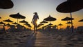 woman having fun walking on beach at sunset Royalty Free Stock Photo