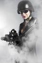 woman holding gun with smoke Royalty Free Stock Photo