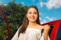 woman holding her keys and smiling for camera in a beautiful sunny day Royalty Free Stock Photo