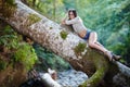 woman laying on a log Royalty Free Stock Photo