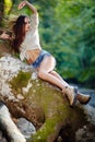 woman laying on a log Royalty Free Stock Photo