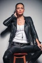 woman in leather clothes holding hand behind her neck Royalty Free Stock Photo
