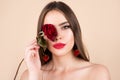 Sexy woman lips with red lipstick and beautiful red rose. Beautiful young pretty woman with healthy skin and red rose Royalty Free Stock Photo