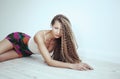 woman with long hair in white room with wooden floor Royalty Free Stock Photo