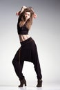 woman model posing in large pants - studio fashion shot