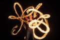 Sexy woman performer create beautiful fire patterns dark outdoors, firedancer
