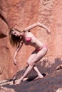 woman posing on red rocks Royalty Free Stock Photo