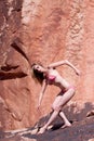 woman posing on red rocks Royalty Free Stock Photo