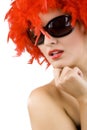 woman with red feather wig and sunglasses Royalty Free Stock Photo