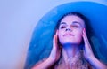 Sexy woman relaxing in bath with closed eyes. Facial spa treatment for beauty and health skin care. Royalty Free Stock Photo