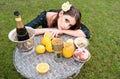 Sexy woman relaxing and eating fruit outdoor. Exotic summer diet, tropical fruits. Top view vegetarian girl enjoy Royalty Free Stock Photo