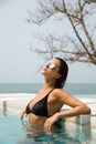 Sexy woman relaxing in the swimming pool Royalty Free Stock Photo