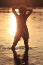 Woman in River in Sunset