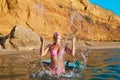 Sexy woman in sea water in swimsuit and surfboard. Idea of summer time, surf sport, desire of adventure, copy space Royalty Free Stock Photo