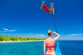 woman standing backwards and watching tropical beach and sea on Maldives island and sea on a traditional Maldivian Dhoni Royalty Free Stock Photo