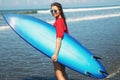 Sexy woman surfer with shortboard on the beach Royalty Free Stock Photo