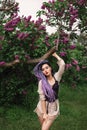Sexy woman under the lilac tree Royalty Free Stock Photo