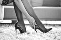 woman in underwear touching high heels black and white