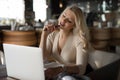 Sexy woman using laptop pc sitting in cafe